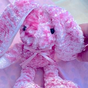 Pink and white stuffed Bunny. Very soft. Ears fold over and Velcro.  Dan Dee